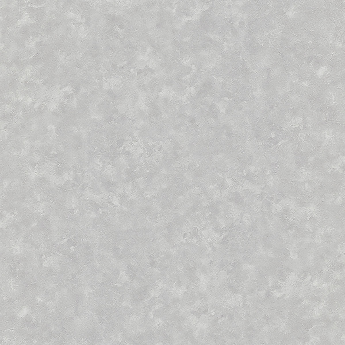 Close-up photo of gold bulb lamp hanging above bed with white bedsheets and knit blanket